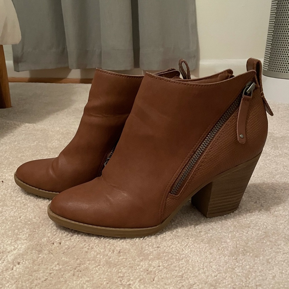 Tan heeled boots with zippers